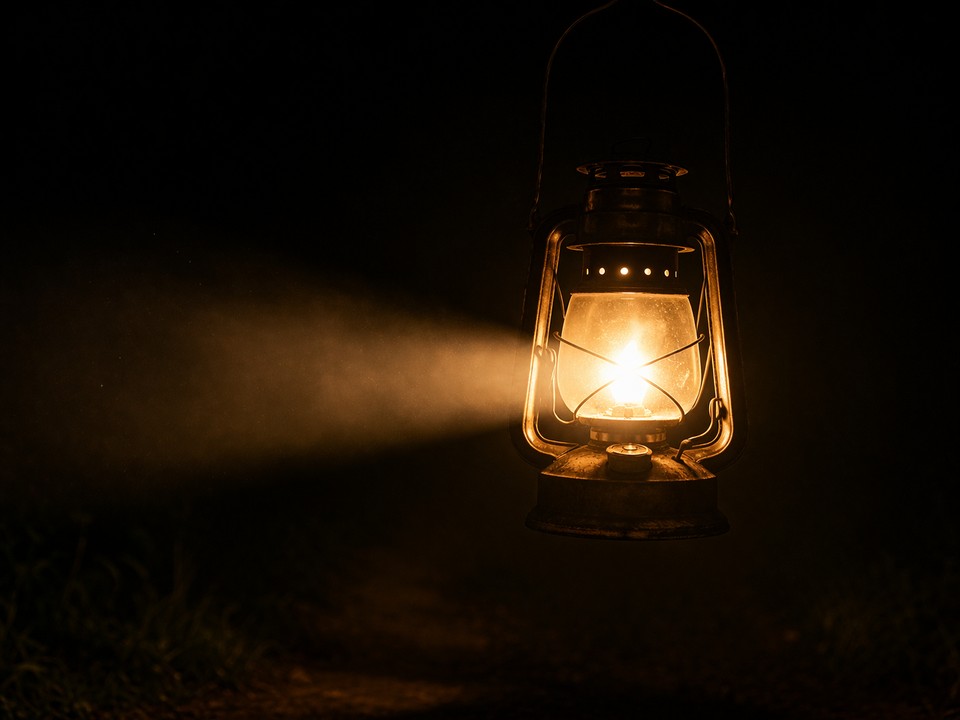 A hurricane lamp cutting through the darkness